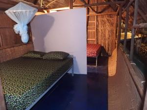 Кровать или кровати в номере Spicy23 - M' Pai Bay