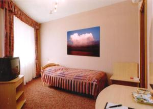 Posteľ alebo postele v izbe v ubytovaní Hozam Wellness és Apartman