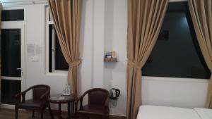 Postel nebo postele na pokoji v ubytování Dang Nguyen Guesthouse