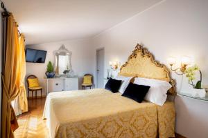 Postel nebo postele na pokoji v ubytování Hotel Principe
