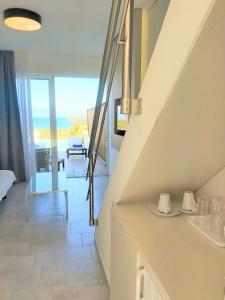 Postel nebo postele na pokoji v ubytování Belussi Exclusive Suites + 5 fotografií