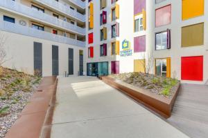 an empty sidewalk in front of a building at Student Factory Paris Bagnolet in Bagnolet