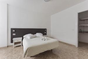 Ένα ή περισσότερα κρεβάτια σε δωμάτιο στο Apartamento Pardela