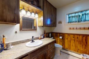 a bathroom with a sink and a toilet at Moose Creek in South Fork +48 photos