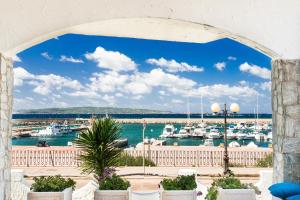 a view of a marina with boats in the water at B&B Sa Cruxitta in Portoscuso