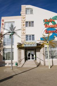 a large white building with a sign on it at Varadero Hotel in Rostov on Don