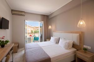 Voodi või voodid majutusasutuse Hotel Rossis toas
