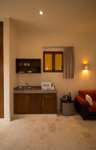 A kitchen or kitchenette at Hotel Boutique SAYAB