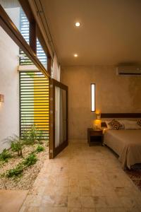 Una cama o camas en una habitación de Hotel Boutique SAYAB