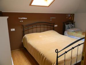 Postel nebo postele na pokoji v ubytování Apartments Lorenco