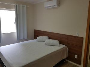 Ένα ή περισσότερα κρεβάτια σε δωμάτιο στο Residencial Miguel