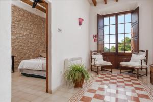 Cama ou camas em um quarto em Petit Hotel Hostatgeria La Victoria