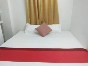 Postel nebo postele na pokoji v ubytování Sukun Guest House