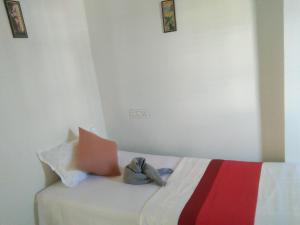 Postel nebo postele na pokoji v ubytování Sukun Guest House