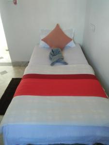 Postel nebo postele na pokoji v ubytování Sukun Guest House