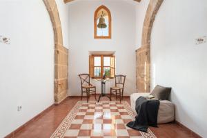 Uma área de estar em Petit Hotel Hostatgeria La Victoria