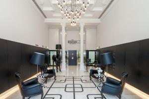 a salon with chairs and a horse in a room at The Boulevard by The Good Neighbour in Lisbon in Lisbon