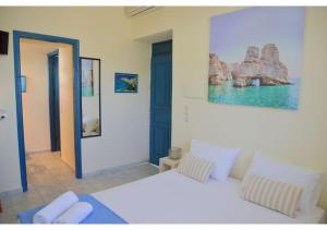 A bed or beds in a room at Tsakonas Plakes Studios