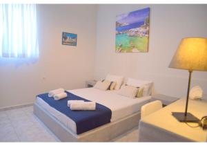 A bed or beds in a room at Tsakonas Plakes Studios