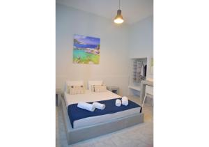 A bed or beds in a room at Tsakonas Plakes Studios