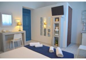 A bed or beds in a room at Tsakonas Plakes Studios