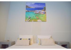 A bed or beds in a room at Tsakonas Plakes Studios