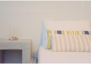 A bed or beds in a room at Tsakonas Plakes Studios