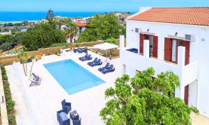 an image of a villa with a swimming pool at Cretan Dream Villa in Georgioupolis