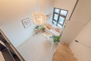
a room with a table and a vase with flowers on it at COZY Duplex in HONGDAE in Seoul
