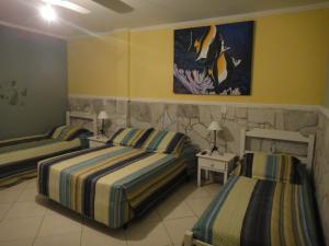 Säng eller sängar i ett rum på Hotel Pousada Cavalo Marinho