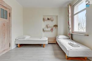 Posteľ alebo postele v izbe v ubytovaní MS Apartments SopotForSix