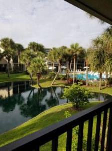 a view of a river from a balcony at Island Life in Saint Augustine Beach