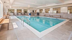 a large pool with blue water in a building at Best Western Plus Ogallala Inn in Ogallala