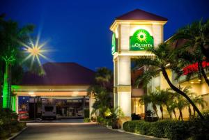 a large building with a clock on the front of it at La Quinta by Wyndham Clearwater Central in Clearwater