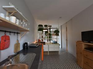 a kitchen with a sink and a counter top at Studio in Ieper with terrace in Ieper