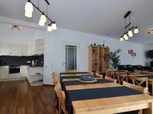 a dining room and kitchen with a table and chairs at Garden view Villa in Medebach K stelberg in Medebach