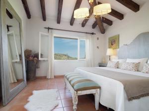 A bed or beds in a room at Rustic House in Mancor with Pool