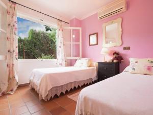 A bed or beds in a room at Rustic House in Mancor with Pool
