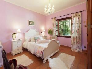 A bed or beds in a room at Rustic House in Mancor with Pool