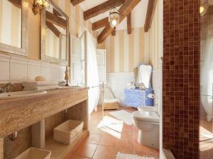 A bathroom at Rustic House in Mancor with Pool