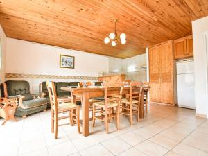 a dining room with a table and chairs at Beautiful holiday home in Argeliers with pool in Argeliers