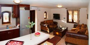 a living room with a couch and a refrigerator at Giovanta Villa in Kondomárion