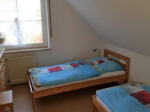 Кровать или кровати в номере Ostsee 1