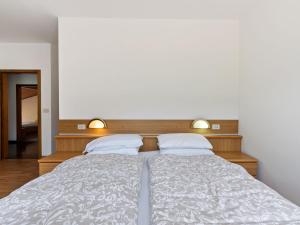 Postel nebo postele na pokoji v ubytování Belvilla by OYO Fiamme Grande