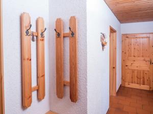a room with four wooden panels on the wall at Holiday flat with balcony in Black Forest in Furtwangen