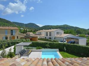 a view from the roof of a house with a swimming pool at Vibrant Villa in Malauc ne with Private Garden in Malaucène