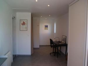 a hallway with a desk and a table in a room at Wonderful holiday home in Audinghen with garden in Audinghen