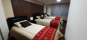 Postel nebo postele na pokoji v ubytování Hostal Jerian
