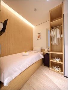 a bedroom with a bed and a closet at Cool Living in Jakarta