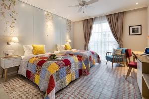Postel nebo postele na pokoji v ubytování Maison De Camille Boutique Hotel + 34 fotografií